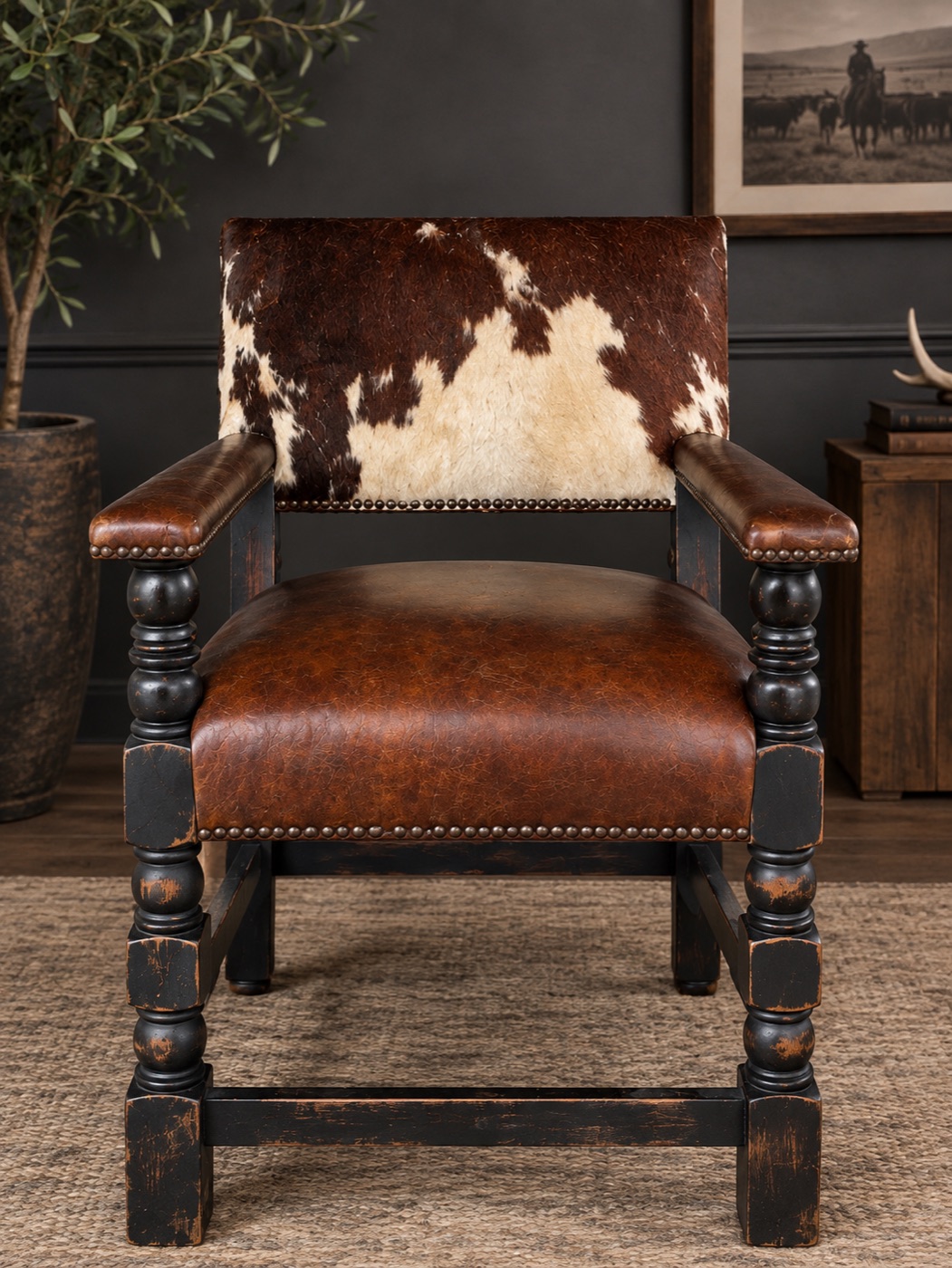 Leather-seat armchair with cowhide back and turned dark wood frame